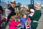 191028-N-DA737-0215 EVERETT, Wash. (Oct 28, 2019) Cmdr. Rob Laird, commanding officer of guided-missile destroyer USS Momsen (DDG 92), is reunited with his family at Naval Station Everett (NSE). Momsen returned to NSE after a deployment to the U.S. 3rd and 7th Fleet areas of operations in support of security and stability. (U.S. Navy photo by Mass Communication Specialist 2nd Class Jonathan Jiang/Released)