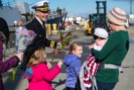 191028-N-DA737-0215 EVERETT, Wash. (Oct 28, 2019) Cmdr. Rob Laird, commanding officer of guided-missile destroyer USS Momsen (DDG 92), is reunited with his family at Naval Station Everett (NSE). Momsen returned to NSE after a deployment to the U.S. 3rd and 7th Fleet areas of operations in support of security and stability. (U.S. Navy photo by Mass Communication Specialist 2nd Class Jonathan Jiang/Released)